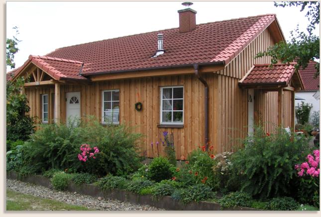 Verkleidung eines Wohnhauses Zimmerei & Holzbau Torsten Herr Wilstedt